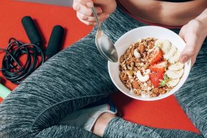 5 Pillars of health - woman being active and eating healthy